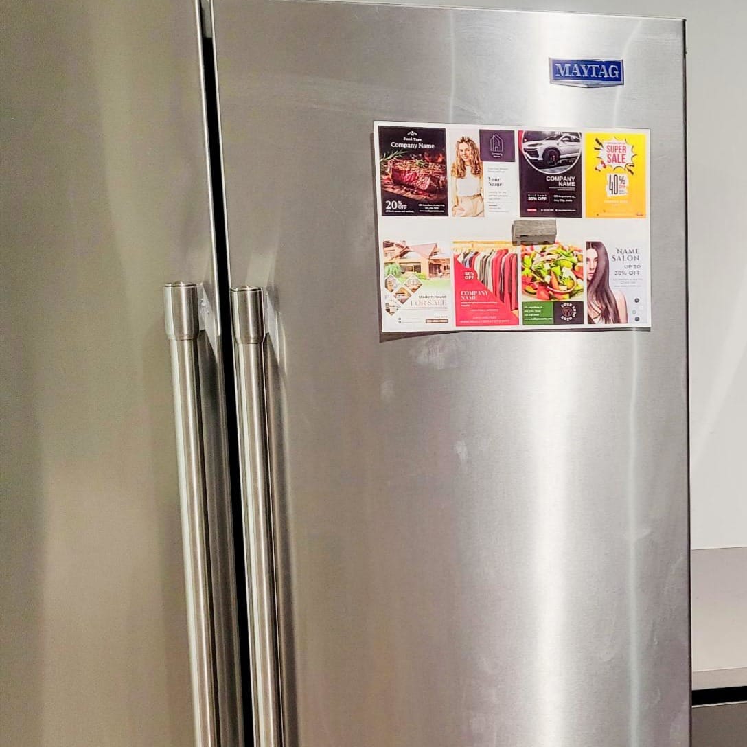 9x12 postcard marketing on the fridge